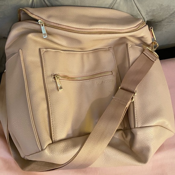 THE GREAT DEBATE! As many of you may know, we discontinued  Fawn Design Blush Diaper Bag